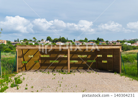 Wooden birdwatching hide in Les Madrigueres wetland reserve, observation structure for wildlife viewing and nature conservation in Catalonia, Spain Wooden birdwatching hide in Les Madrigueres wetland reserve, observation structure for wildlife viewing and nature conservation in Catalonia, Spain 140304231