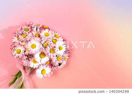 Concept of minimalist modern aesthetics and elegant beauty. Beautiful summer banner with a bouquet of blooming daisies, a design template, and a display stand. Abstract floral arrangement 140304299