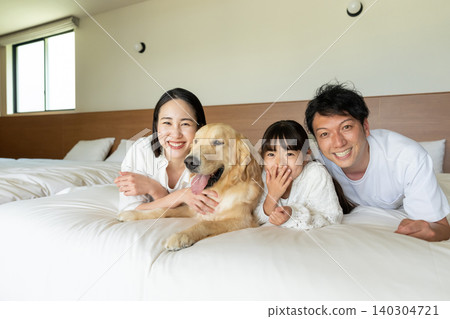 Young family, pet dog, happy family image Young family, pet dog, happy family image 140304721