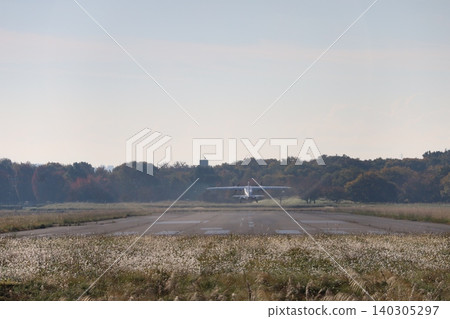 Airplane taking off from runway Airplane taking off from runway 140305297