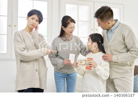 Grandmother and grandfather giving New Year's money to their grandchild 140306187