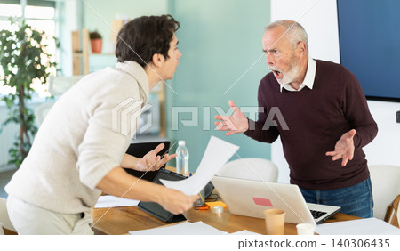 Elderly and young men arguing loudly in office Elderly and young men arguing loudly in office 140306435