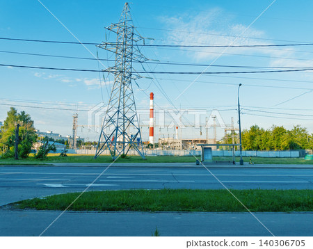 Industrial power pylon and factory skyline at roadside Industrial power pylon and factory skyline at roadside 140306705