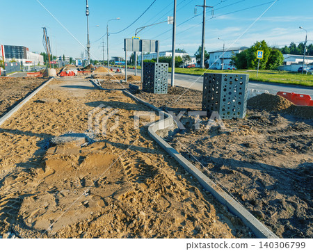 Urban sidewalk construction site with utility boxes and curb installation Urban sidewalk construction site with utility boxes and curb installation 140306799