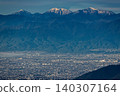 The Kofu Basin and the Southern Alps mountain range as seen from Mount Daibosatsu-rei, bathed in the morning sun. 140307164