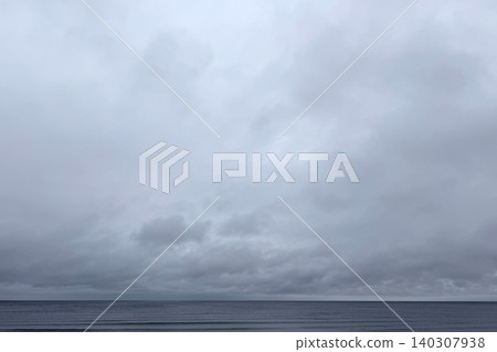 The cloudy sky and sea, with their beautiful, subdued colors. 140307938