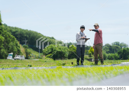 Men using tablets for farming Men using tablets for farming 140308955