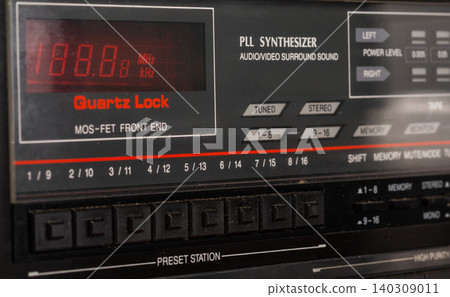 Close-up of a radio frequency indicator. Vintage tuner indicator. Close-up of a radio frequency indicator. Vintage tuner indicator. 140309011