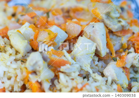 Rice pilaf with pieces of chicken, close-up Rice pilaf with pieces of chicken, close-up 140309038