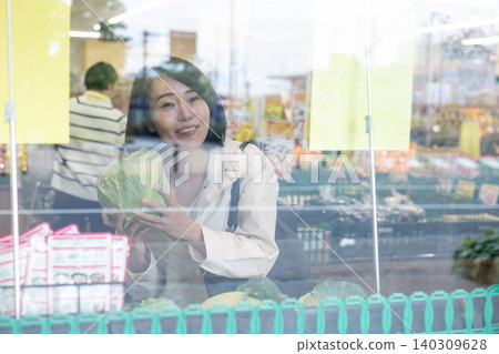 Housewife shopping at a supermarket Housewife shopping at a supermarket 140309628