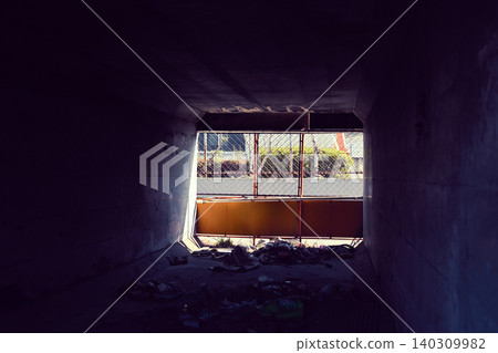 Inside the tunnel blocked by a fence Inside the tunnel blocked by a fence 140309982