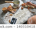 Pregnant woman baking cookies for baby announcement 140310418