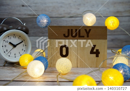 Wooden Calendar Showing the Date of July 4th. Day 4 of July month Wooden Calendar Showing the Date of July 4th. Day 4 of July month 140310727