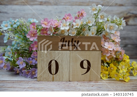 Wooden Calendar Showing the Date of July 9th. Day 9 of July month Wooden Calendar Showing the Date of July 9th. Day 9 of July month 140310745