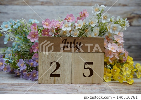 Wooden Calendar Showing the Date of July 25th. Day 25 of July month 140310761