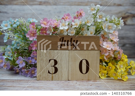 Wooden Calendar Showing the Date of July 30th. Day 30 of July month 140310766