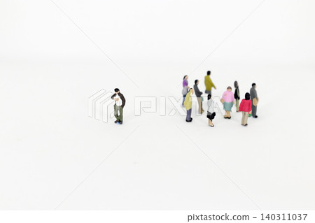A miniature person isolated from the group A miniature person isolated from the group 140311037
