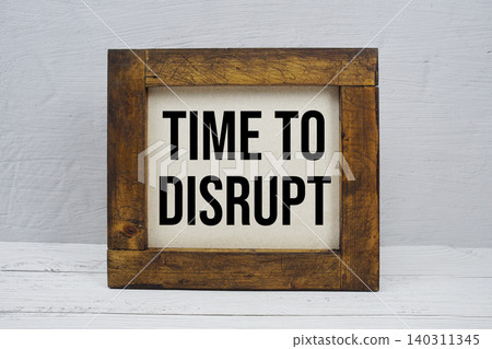 Time To Disrupt text written on wooden board Time To Disrupt text written on wooden board 140311345