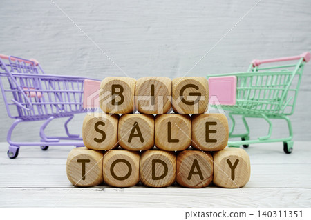 Big Sale Today alphabet letters with trolley shopping cart on wooden background Big Sale Today alphabet letters with trolley shopping cart on wooden background 140311351