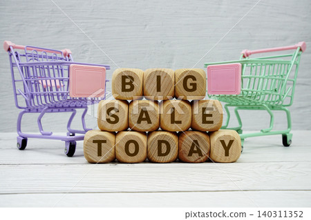 Big Sale Today alphabet letters with trolley shopping cart on wooden background 140311352