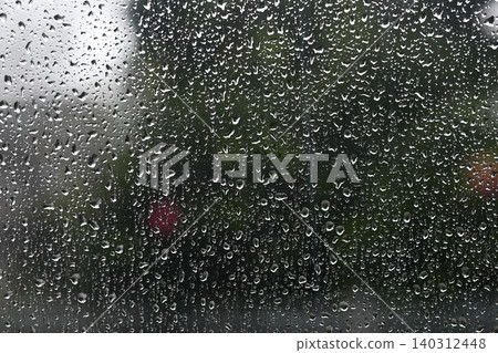 Raindrops on the car window Raindrops on the car window 140312448