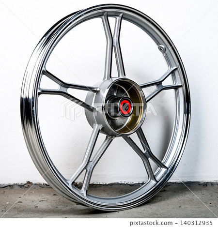 Silver motorcycle wheel rim cast alloy five spoke design in perspective view isolated on white background for motorbike custom and spare repair part 140312935