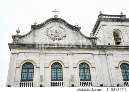 Neoclassical grey facade of historic St Lazarus Church built in 1557 and rebuilt in 1885 at street corner Neoclassical grey facade of historic St Lazarus Church built in 1557 and rebuilt in 1885 at street corner 140312954