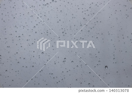 Close up of rain droplets on window glass background 140313078
