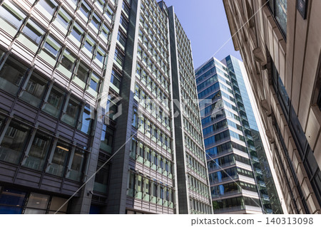 Low angle view of corporate office buildings and urban architecture Low angle view of corporate office buildings and urban architecture 140313098