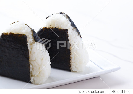 Onigiri - Delicious rice balls made with freshly cooked rice Onigiri - Delicious rice balls made with freshly cooked rice 140313164