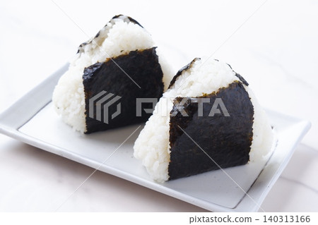 Onigiri - Delicious rice balls made with freshly cooked rice Onigiri - Delicious rice balls made with freshly cooked rice 140313166