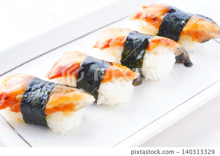 Unagi nigiri sushi - plump and delicious looking unagi nigiri sushi Unagi nigiri sushi - plump and delicious looking unagi nigiri sushi 140313329