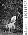 Antique garden chair surrounded by ivy 140313797