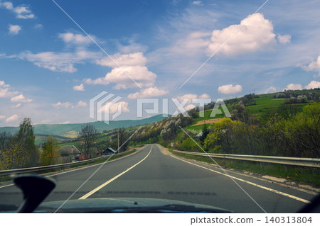 View from windscreen. Driving a car on mountain road View from windscreen. Driving a car on mountain road 140313804