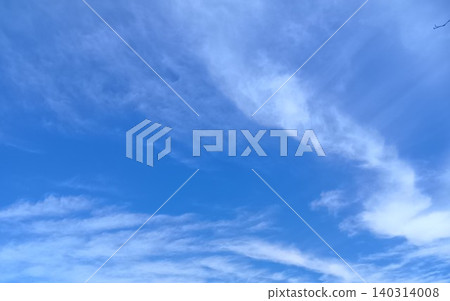 White clouds floating in a clear blue sky White clouds floating in a clear blue sky 140314008