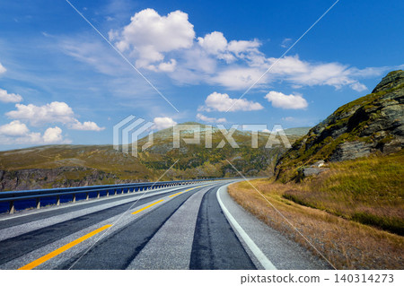A mountain road along a fjord. The nature of Norway. A mountain road along a fjord. The nature of Norway. 140314273