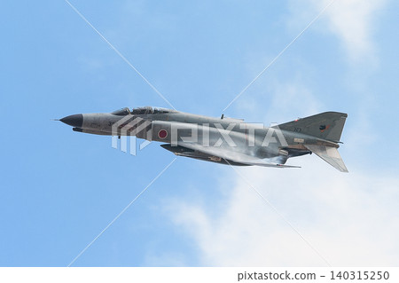 A Japan Air Self-Defense Force F-4EJ Kai Phantom II emerges from the clouds. A Japan Air Self-Defense Force F-4EJ Kai Phantom II emerges from the clouds. 140315250