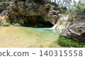 Secret turquoise pool and small waterfall in canyon 140315558