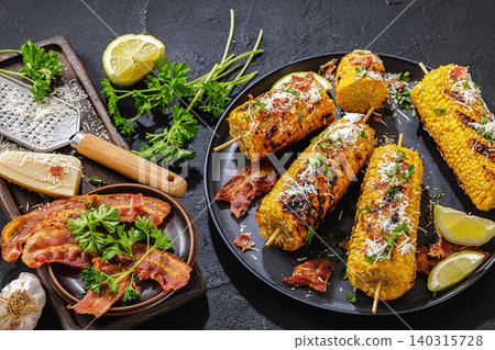 Corn elote street style is served on a plate Corn elote street style is served on a plate 140315728