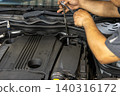 Automotive mechanics working in a car repair shop: Vehicle inspection and maintenance 140316172