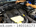 Automotive mechanics working in a car repair shop: Vehicle inspection and maintenance 140316173