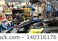 Automotive mechanics working in a car repair shop: Vehicle inspection and maintenance 140316176