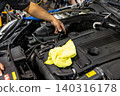 Automotive mechanics working in a car repair shop: Vehicle inspection and maintenance 140316178