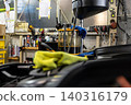 Automotive mechanics working in a car repair shop: Vehicle inspection and maintenance 140316179