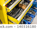 Automotive mechanics working in a car repair shop: Vehicle inspection and maintenance 140316180
