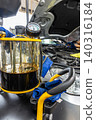Automotive mechanics working in a car repair shop: Vehicle inspection and maintenance 140316184