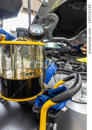 Automotive mechanics working in a car repair shop: Vehicle inspection and maintenance Automotive mechanics working in a car repair shop: Vehicle inspection and maintenance 140316184