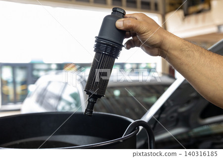 Automotive mechanics working in a car repair shop: Vehicle inspection and maintenance Automotive mechanics working in a car repair shop: Vehicle inspection and maintenance 140316185