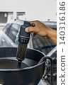 Automotive mechanics working in a car repair shop: Vehicle inspection and maintenance 140316186