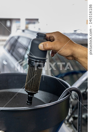 Automotive mechanics working in a car repair shop: Vehicle inspection and maintenance 140316186